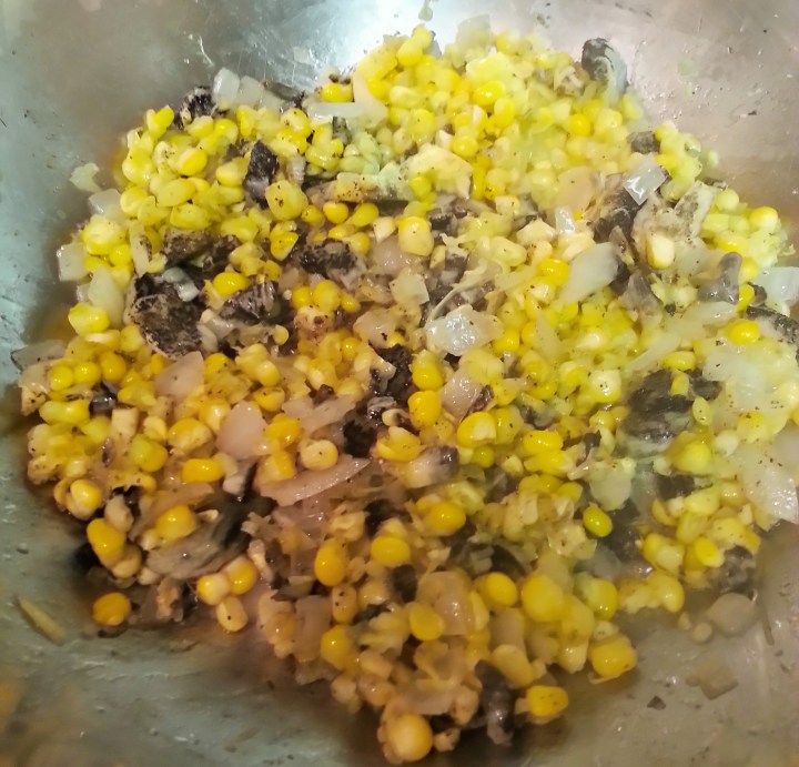 Huitlacoche with corn was delicious served in a tortilla.