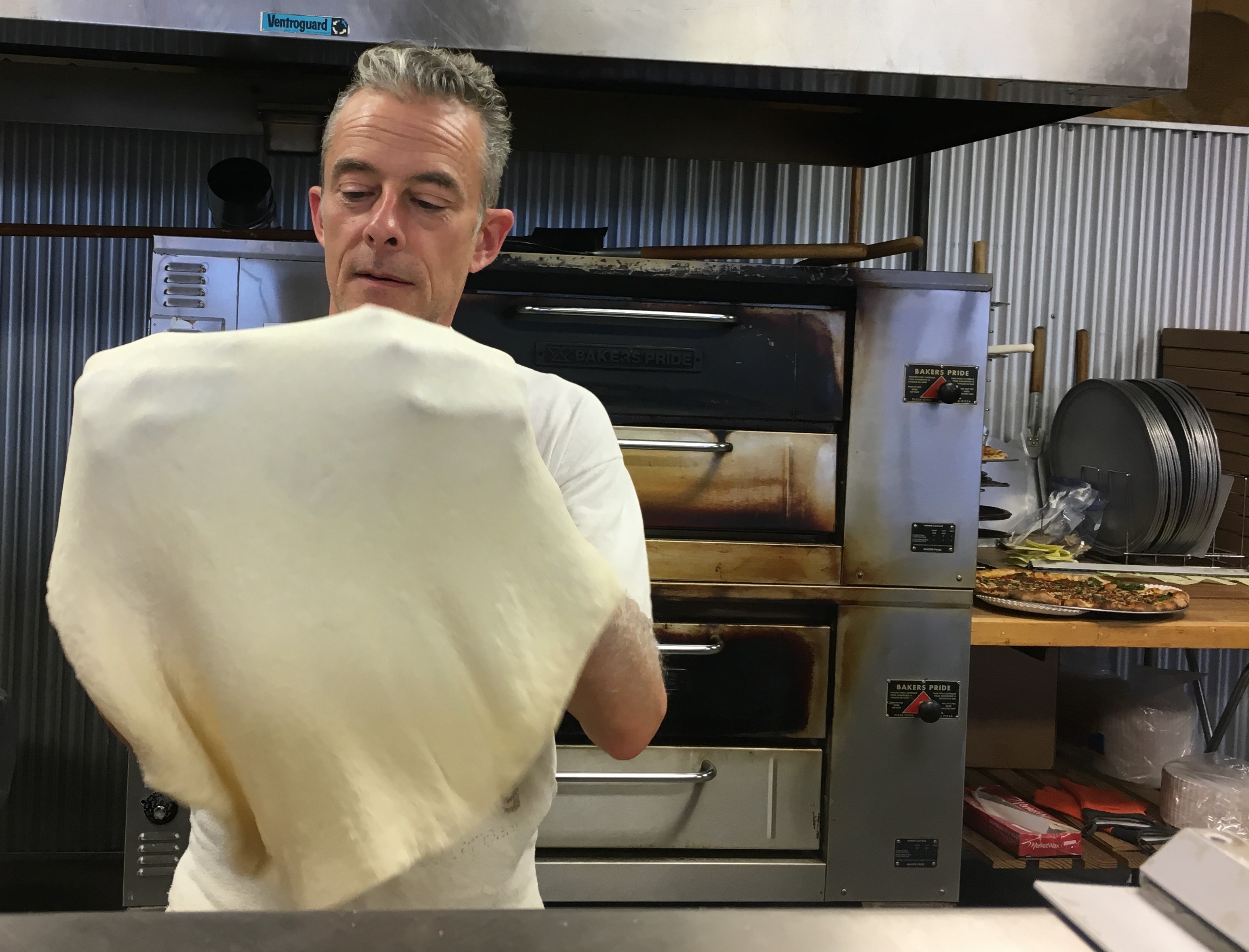 Ronnie hand-strecthes every pizza dough.
