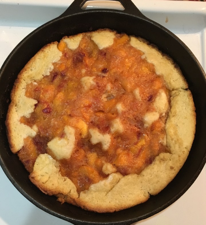 Cast iron skillet peach cobbler... easy and so delicious.